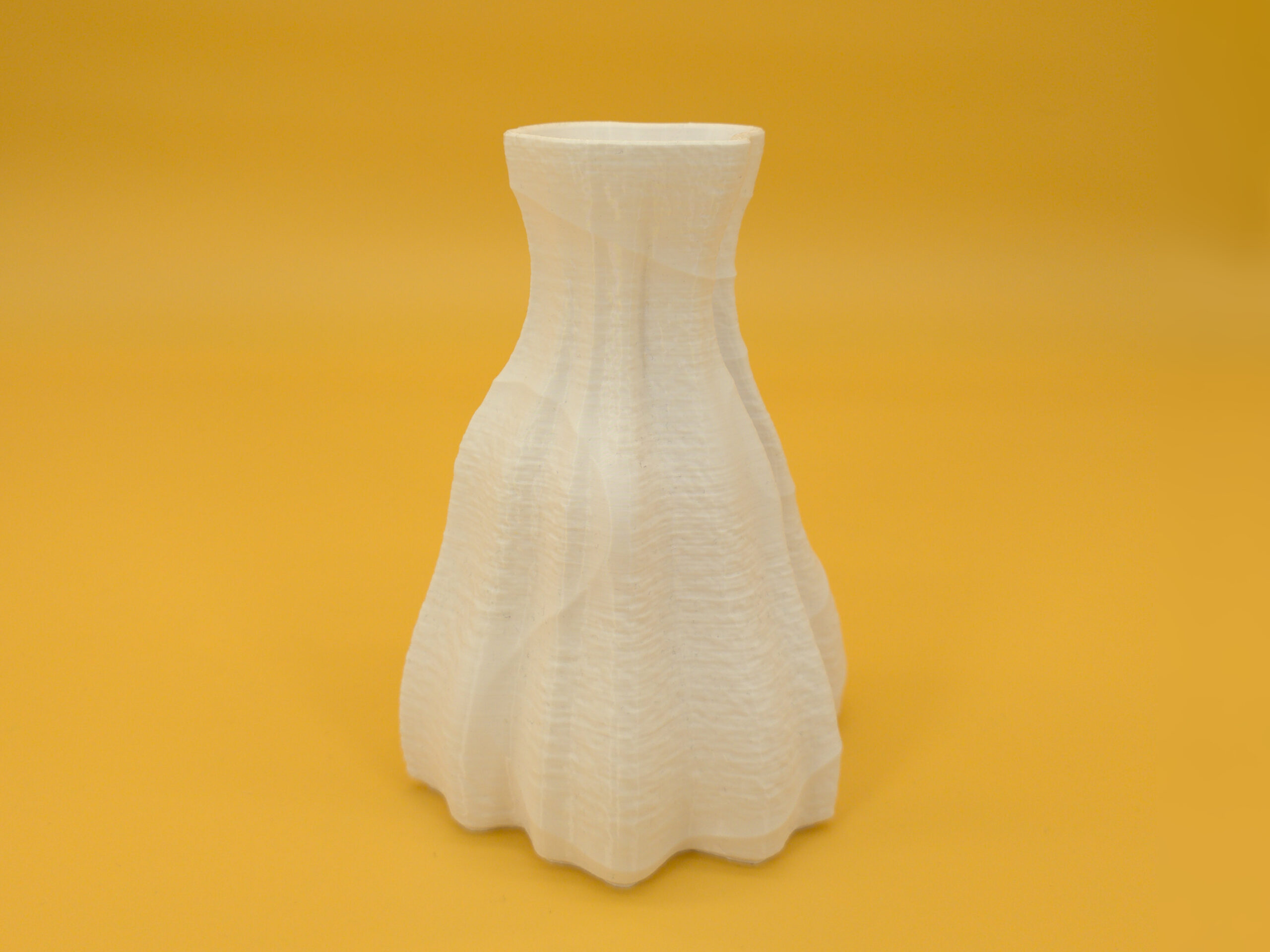20250909__dual_texture_vase_left Left view of eco-friendly, pleasing, white vase for dry decoration that features durability and a dual texture with an asymmetric shape!