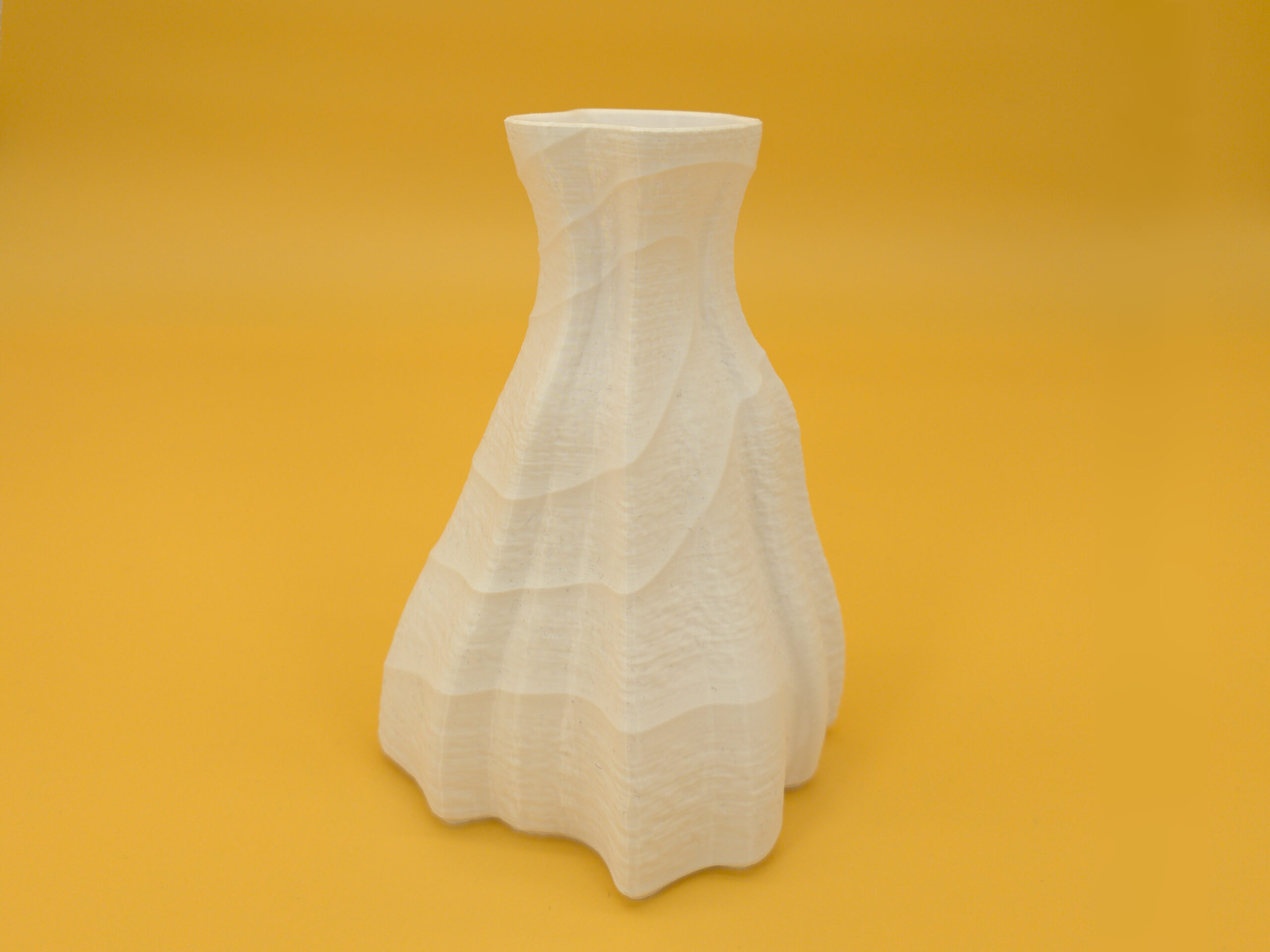 20250909__dual_texture_vase_right Right view of eco-friendly, pleasing, white vase for dry decoration that features durability and a dual texture with an asymmetric shape!